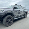 Dark gray metallic toyota hilux 2021-2024 with black wheels and srs cruiser decals featuring oem style grey layer fender flares