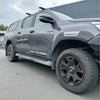 Gray metallic toyota hilux srs cruiser pickup with black wheels and rugged off-road tires featuring fender flare gray layer