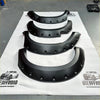 Black matte textured metal fender flares with rugged angular design and mounting holes for toyota hilux vigo 2012-2015