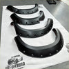 Black matte textured fender flares for toyota hilux vigo 2012-2015 with rugged angular design and bolt style holes