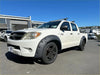 White toyota hilux pickup truck with textured black bolt style fender flares and alloy wheels 2012-2015 model