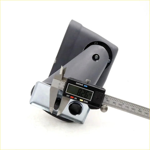 Gray plastic mounting bracket for fender mirror x2 on toyota hilux with digital caliper measuring 8.26 mm