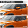Black folding tow side mirror with integrated turn signal for orange 2022-2023 toyota tundra suv shown from back side