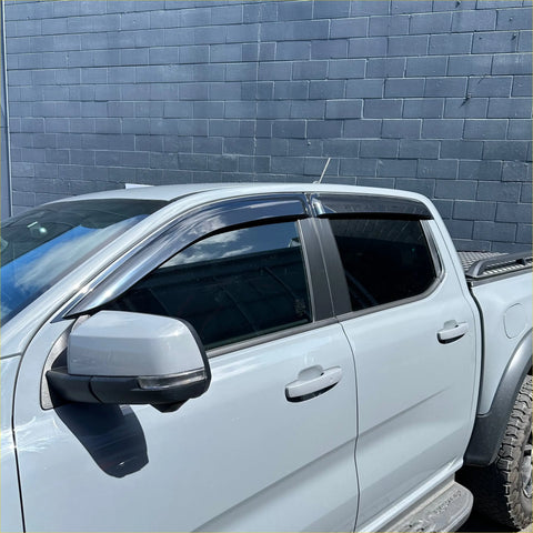 Clear transparent plastic window visors installed on white ford ranger 2022+ for weather shield door protection