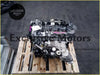 Silver metallic ford ranger WEAT engine block with black hoses and components resting on a wooden pallet