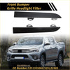 Black plastic front bumper grille headlight filler for toyota tacoma 2001-2004 shown from the back side