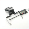 Black metal front door hinge set for mazda capella 626 hatchback 1985-1987 being measured with digital caliper