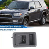 Dark gray plastic front passenger side interior door handle with rectangular recessed design and central circular indentation for toyota 4runner 1989-1995