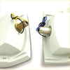 White plastic front signal corner lights for mazda b2200 with brass sockets and color-coded wiring shown from back side