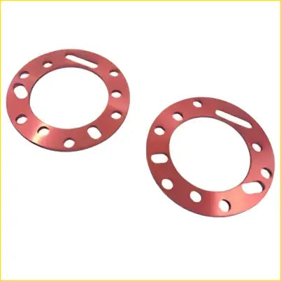 Two red metallic front strut spacer hub flanges with circular holes for holden colorado 7 trailblazer rg 4wd