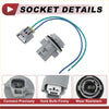 Gray plastic automotive bulb socket with attached blue and green wires.