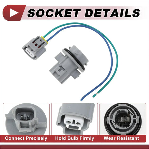 Gray plastic automotive bulb socket with attached blue and green wires.