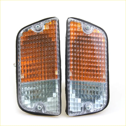 A pair of amber and clear rectangular side marker lights with textured lenses for front turn signal on nissan datsun 620