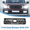 Black front upper bumper grille for Toyota Land Cruiser FJ79 with central oval emblem and diagonal slat design