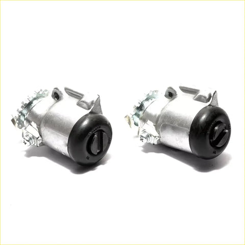 Front wheel brake cylinder lhs for toyota hilux 1984-1988 showing silver and black ignition coil assemblies with metal terminals