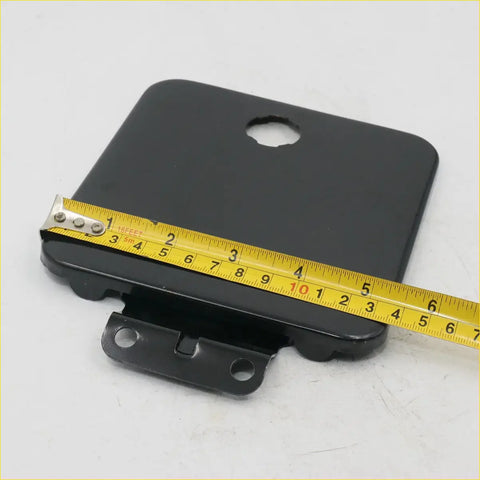 Black plastic mounting plate with circular top hole and three lower bracket holes for fuel door cover mitsubishi l200 delica pajero 1985 1995 backside