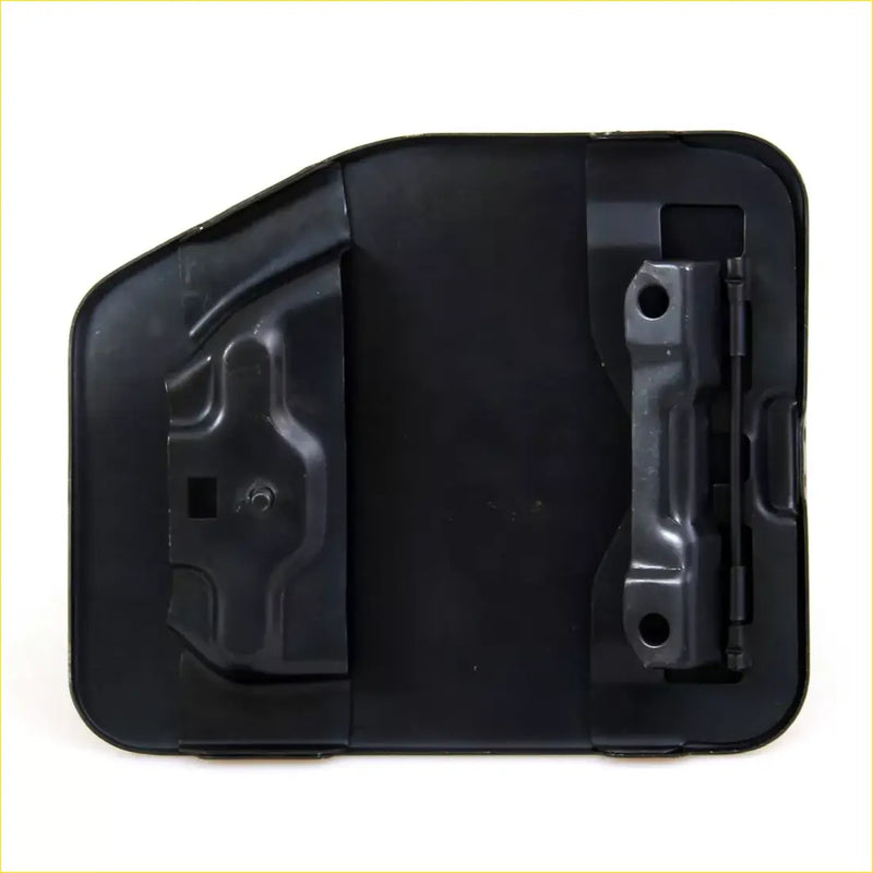 Back side of black plastic fuel door cover with molded contours and metal hinge for Toyota Hilux 1988-1997