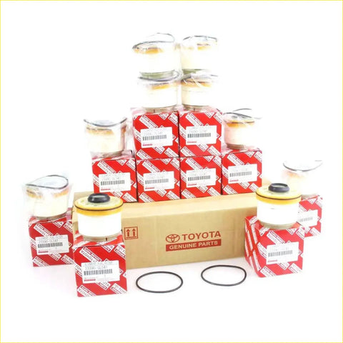 Toyota genuine fuel filters in red and white packaging with some units outside boxes for hilux 2004-2016