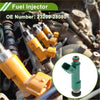 Close-up of yellow plastic and metal fuel injector with inset green version for toyota highlander base 2.4 2004-2007