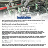Fuel injector for toyota rav4 and caldina with green and purple plastic bodies and metallic connectors on engine mount