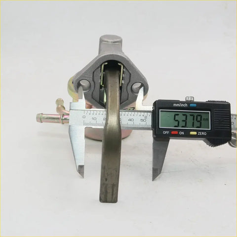 Gray metallic carburetor for datsun nissan patrol junior 1984-1986 with digital caliper measuring 53.79 mm width