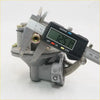 Gray metallic carburetor being measured with digital caliper for fuel pump toyota hilux 2nd gen 1972-1978