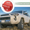 Red plastic fuel tank cap cover with regular label and safety instructions for toyota 4wd ute offroad models