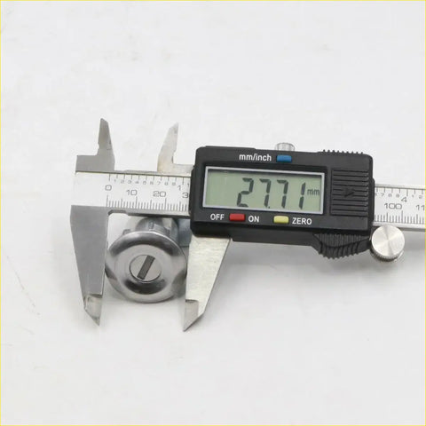 A shiny chrome fuel tank gas filler lock cylinder for toyota hilux 1983-1988 measured with digital caliper
