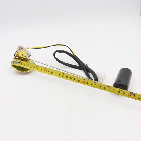 Gold-colored fuel tank gauge sending unit with black cable and cylindrical cap for nissan datsun 720 2wd dx 1979-1986