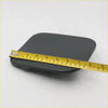 Black rectangular gas door fuel lid cover for Toyota Hilux with matte finish and yellow measuring tape on top