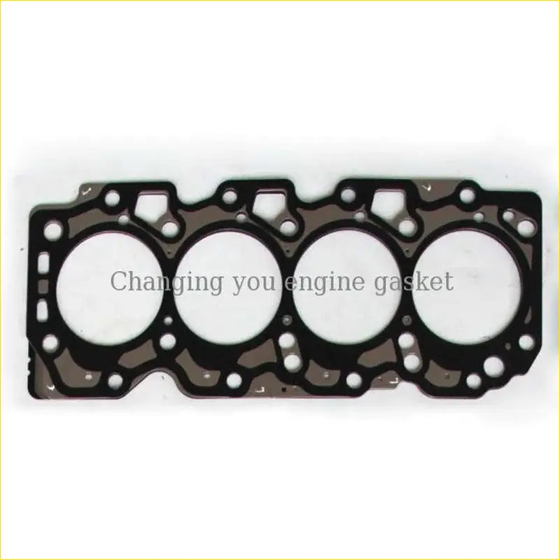 Black metal cylinder head gasket with four circular openings and textured surface for toyota carina corolla 1.8l