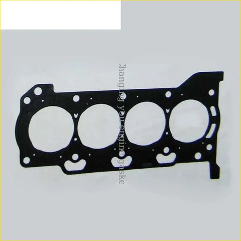 Black metal cylinder head gasket with four circular openings and mounting holes for toyota corolla yaris auris engines