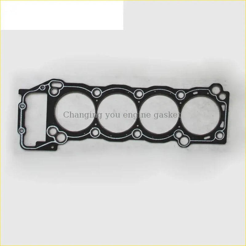 Black engine head gasket with four circular openings and cutouts for cylinder alignment for toyota hilux 3rZfe