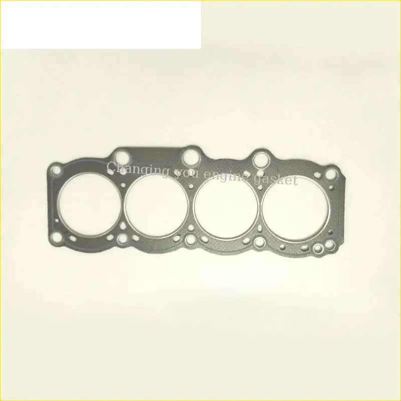 Black engine head gasket with four circular openings and textured surface for toyota celica 3sg e 3s-ge engines