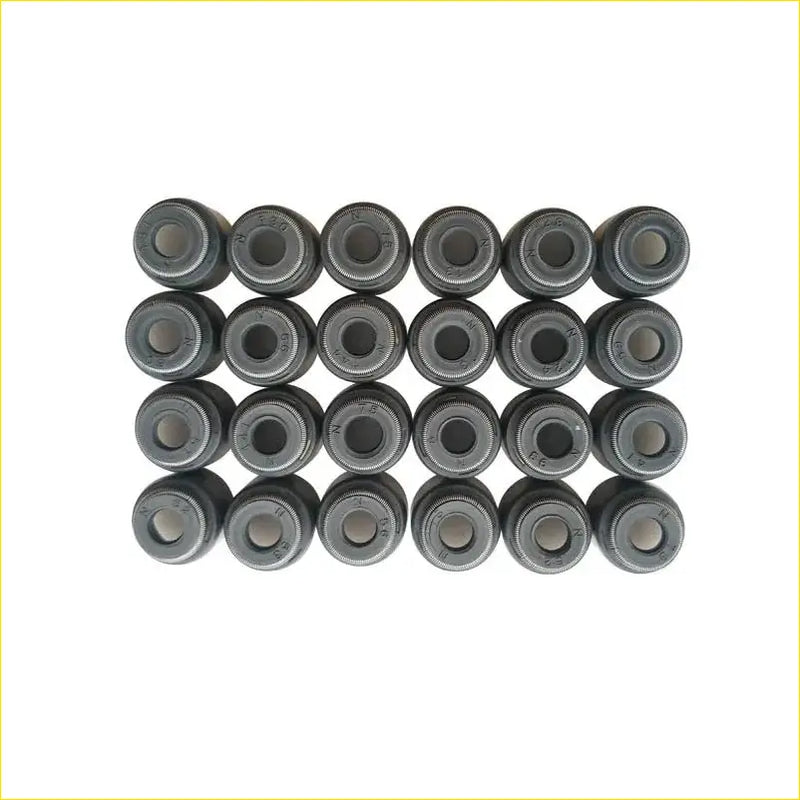 Set of 24 black metallic valve stem oil seals for gasket pro 99-05 lexus is i jce1 gxe1 200 1gfe engine use arranged in grid
