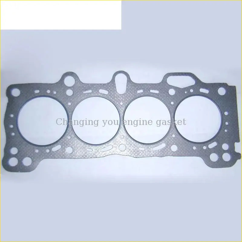 Black cylinder head gasket with four circular openings and textured surface for gasket pro b20a honda prelude accord iii