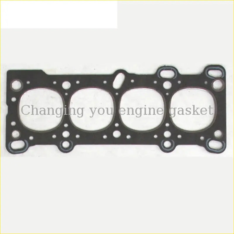 Black engine head gasket with four circular openings and edge holes for mazda familia 323 16v sohc diesel model