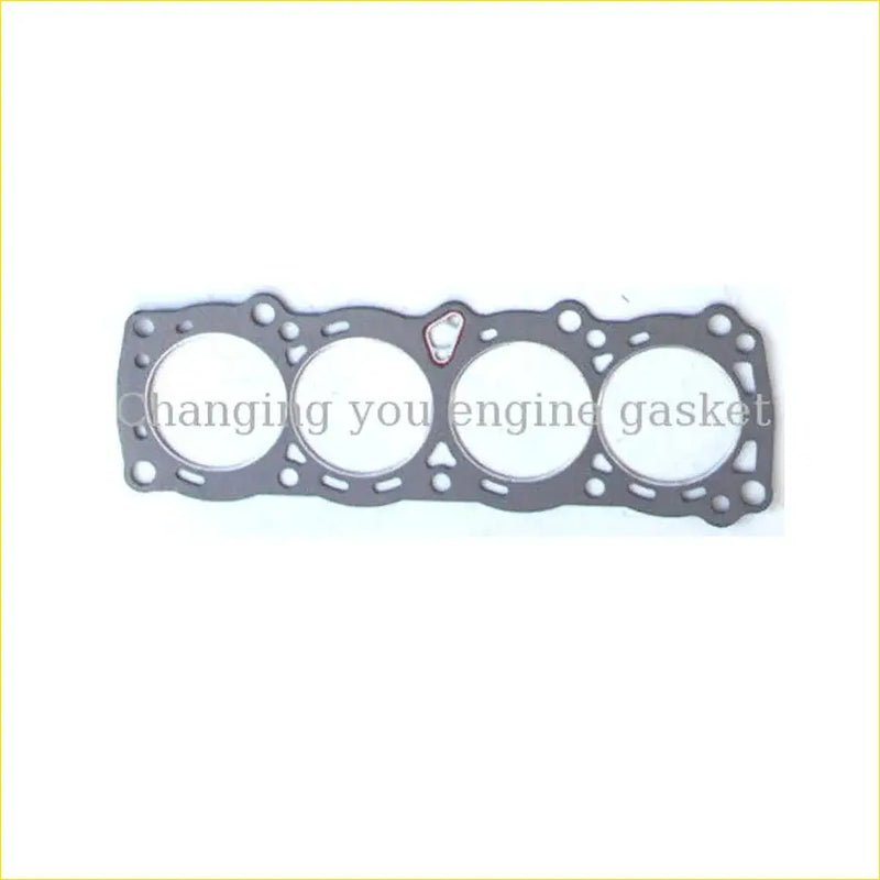 Gray metallic engine head gasket with four round openings and red tab for nissan sunny cherry pulsar by gasket pro