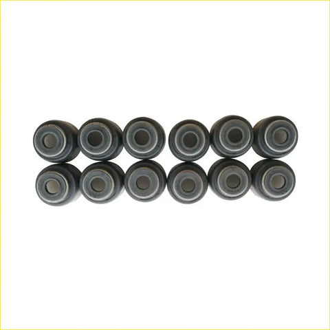Ten black rubber valve stem seals arranged in two rows for daihatsu sirion 1.0l gasket pro oil seals