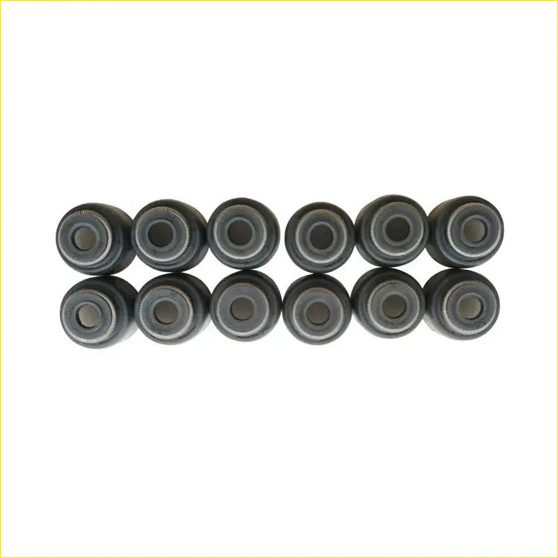 Ten black rubber valve stem seals arranged in two rows for daihatsu sirion 1.0l gasket pro oil seals