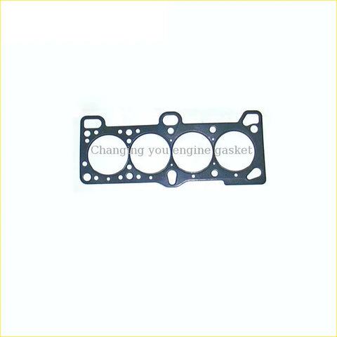 Black metal cylinder head gasket with four circular openings and small holes for hyundai accent iii g4ed engine