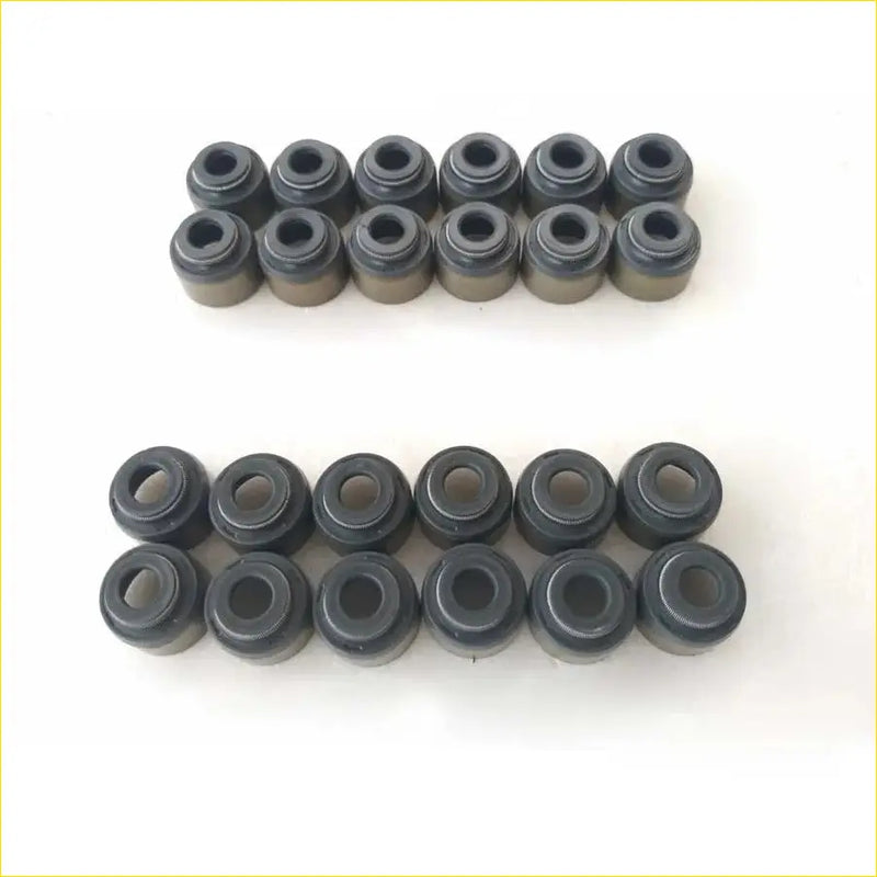 Black rubber valve stem seals arranged in two neat rows for hyundai santa i 27l gasket pro 24pcs set