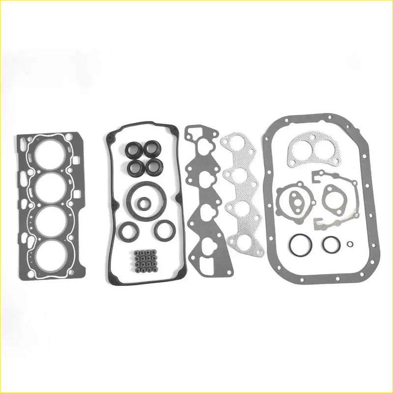Set of black and silver automotive engine gaskets with cutouts for cylinder heads oil pan and intake manifold for mitsubishi pajero mini 700 dohc 4a30 md