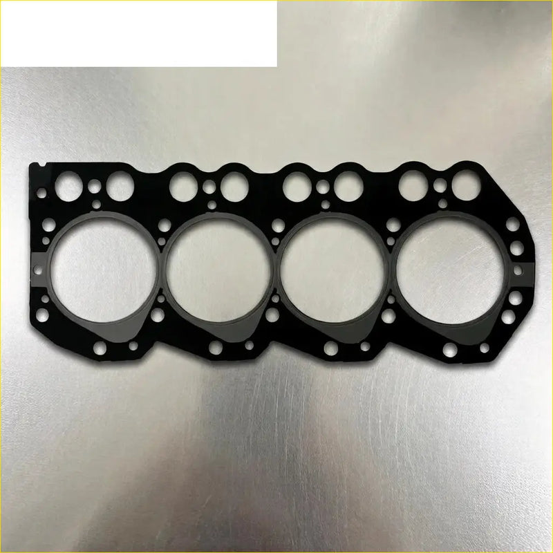 Black rubber cylinder head gasket with four large holes and smaller edge holes for nissan navara d21 2.7 td27 metal head