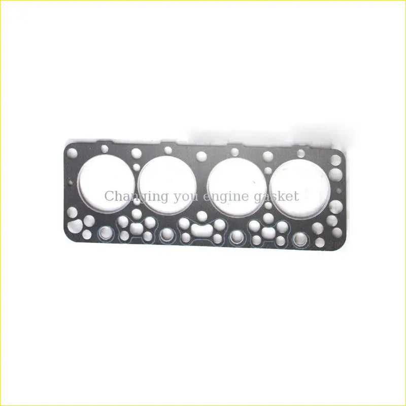 Black engine head gasket with four circular openings and smaller holes for nissan pick-up 720 king-cab urvan sd23
