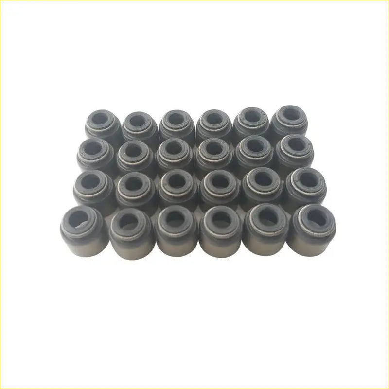 Set of 24 black metallic valve stem oil seals for nissan teana 35l 24v vq35de arranged in a grid pattern