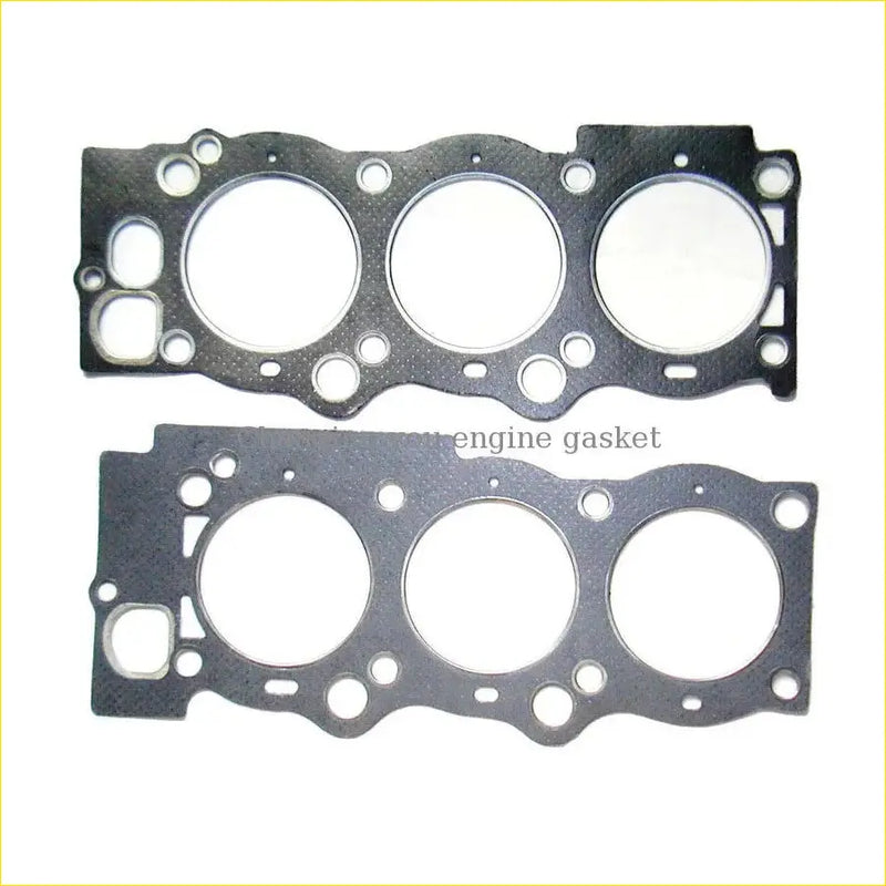 Black engine gasket with three circular openings and mounting holes for gasket pro toyota camry 25l 16v 2vzfe