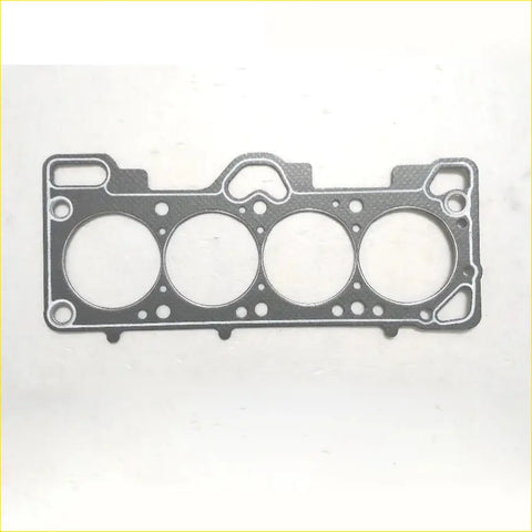 Black engine head gasket with four circular openings and textured surface for Hyundai Accent 1.5 cylinder head gasket