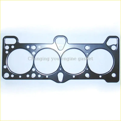 Black metal cylinder head gasket with four circular openings and smaller holes for precise sealing in hyundai 2000 engine