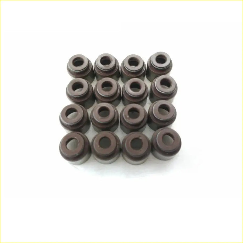 Dark brown cylindrical valve stem oil seals arranged in a grid for nissan sunny gasket pro ga14de ga15de 16pcs set
